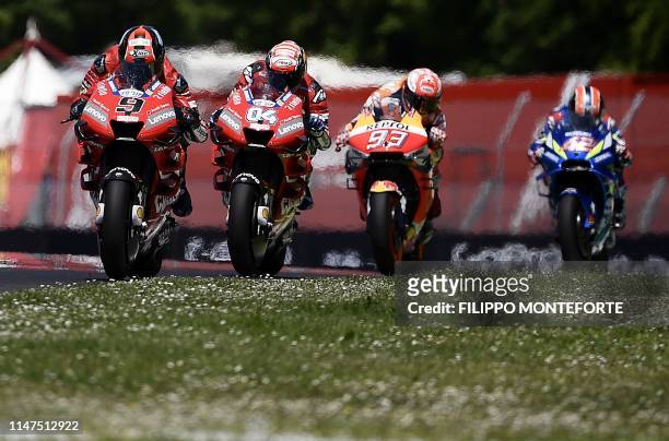 Italy's Danilo Petrucci, Italy's Andrea Dovizioso, Spain's Marc Marquez and Spain's Alex Rins ride during the Italian Moto GP Grand Prix at the...