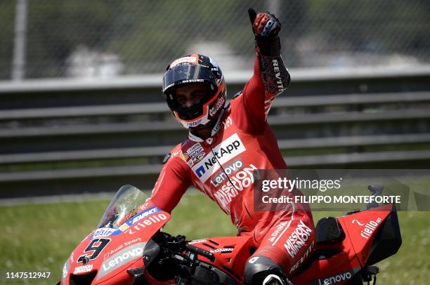 Italy's Danilo Petrucci celebrates after winning the Italian Moto GP Grand Prix at the Mugello race track on June 2, 2019 in Scarperia e San Piero.