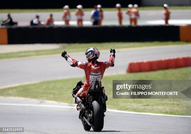 Italy's Danilo Petrucci celebrates after winning the Italian Moto GP Grand Prix at the Mugello race track on June 2, 2019 in Scarperia e San Piero.