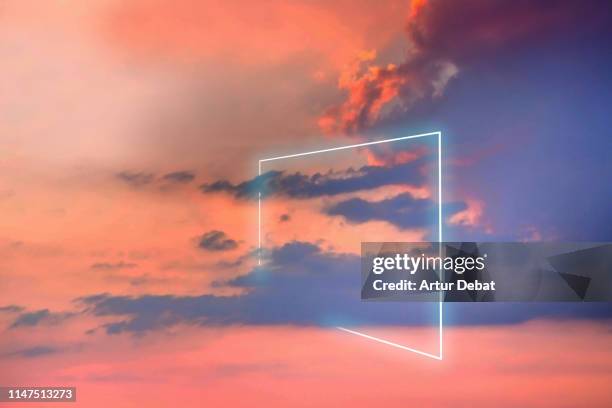 poetic neon square light between the clouds in beautiful sunset sky. - imagination stock-fotos und bilder