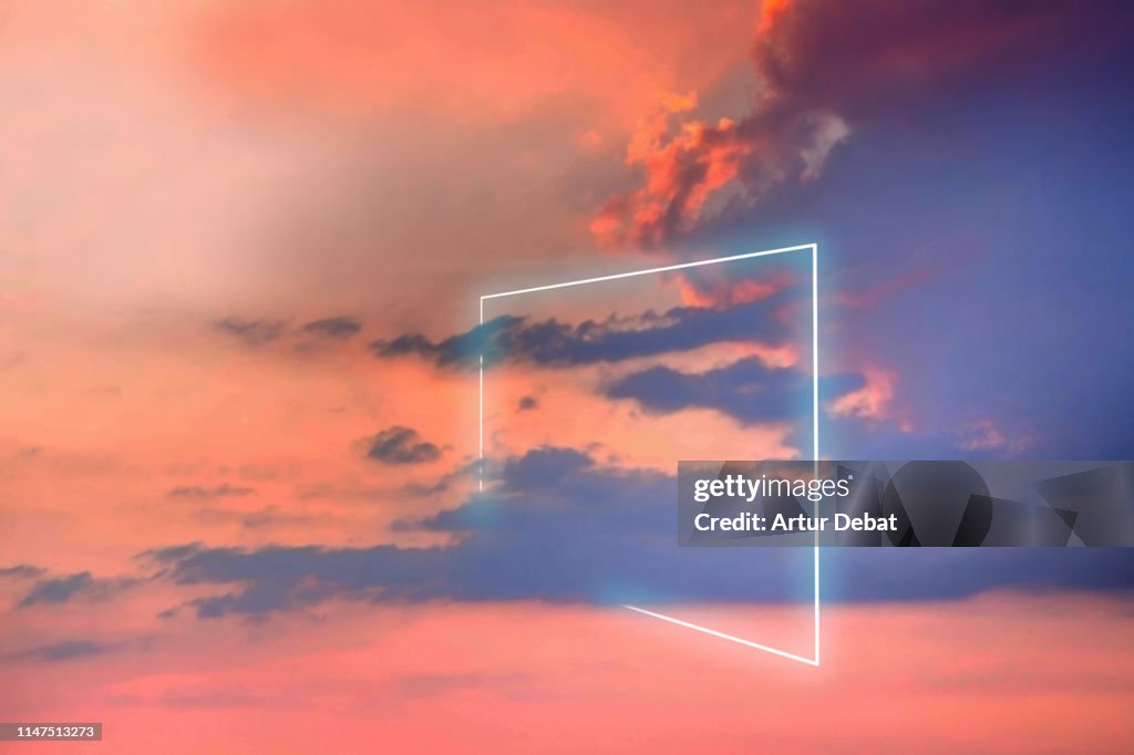 Poetic neon square light between the clouds in beautiful sunset sky.