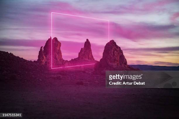 geometric neon light installation at dusk in a remote location in the california desert. - light natural phenomenon stock pictures, royalty-free photos & images
