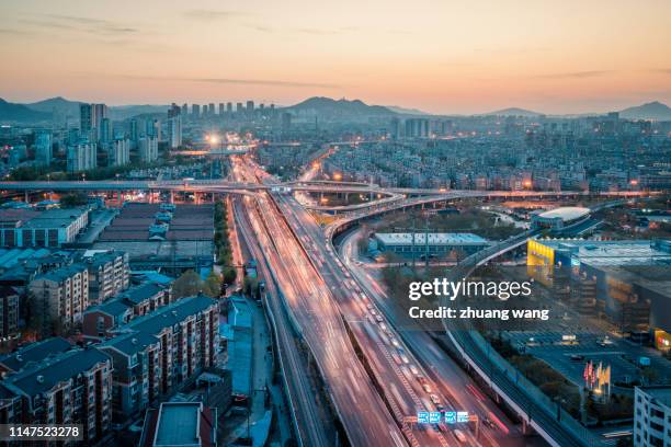 sunset of overpass - busy highway stock pictures, royalty-free photos & images