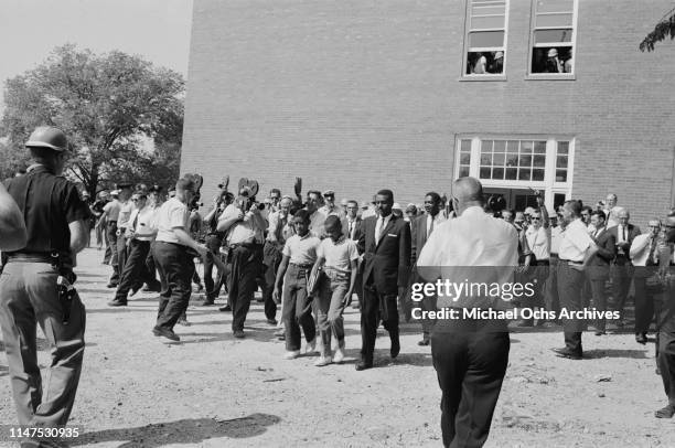 Schoolboys Dwight and Floyd Armstrong arrive at Graymont Elementary School in Birmingham, Alabama, on the first day of desegregation of schools in...