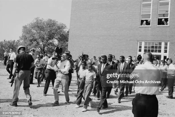 Schoolboys Dwight and Floyd Armstrong arrive at Graymont Elementary School in Birmingham, Alabama, on the first day of desegregation of schools in...
