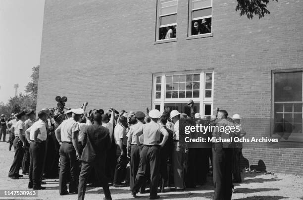Schoolboys Dwight and Floyd Armstrong arrive at Graymont Elementary School in Birmingham, Alabama, on the first day of desegregation of schools in...