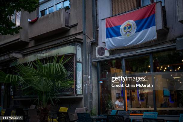 Man sits in a bar in the majority ethnic-Serb northern part of the city on May 5, 2019 in Mitrovica, Kosovo. A recent EU-backed summit failed to...
