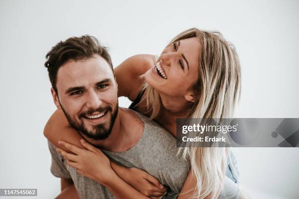 true love: piggyback with couple love - funny husband stock pictures, royalty-free photos & images