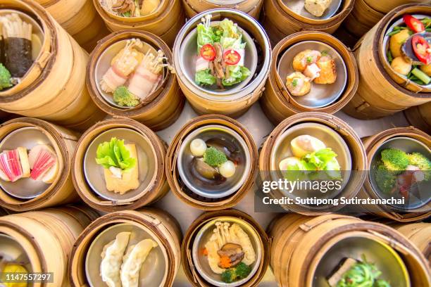 many kind of boil yumcha, dim sum in bamboo steamer, chinese cuisine - dim sum meal stock pictures, royalty-free photos & images