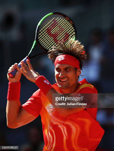 David Ferrer of Spain in action against Roberto Bautista Agut of Spain during day four of the Mutua Madrid Open at La Caja Magica on May 07, 2019 in...