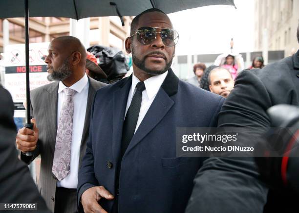 Singer R. Kelly leaves the Leighton Courthouse following his status hearing, in relation to the sex abuse allegations made against him, on May 07,...