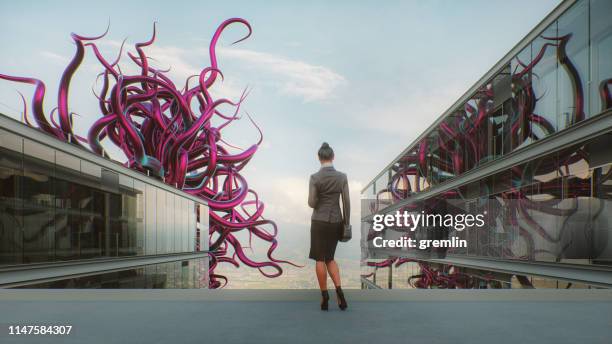 abstract office businesswoman with alien tentacles - alien tentacle stock pictures, royalty-free photos & images