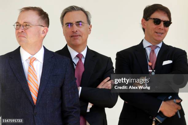 Acting White House Chief of Staff Mick Mulvaney, White House Counsel Pat Cipollone, and Principal Deputy Press Secretary Hogan Gidley listen during a...