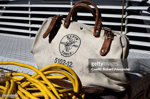 An electrician's canvas tool bag sits on a service truck in Santa Fe, New Mexico. Klein Tools is an American hand tool manufacturer based in...
