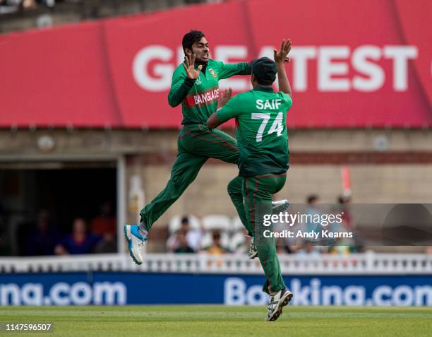 Mehedi Hasan of Bangladesh celebrates with team mate Mohammad Saifuddin after taking the wicket of Faf du Plessis of South Africa during the Group...