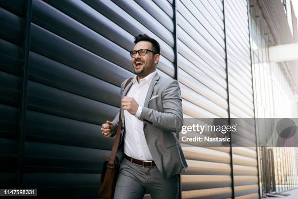 young businessman getting late - businessman running stock pictures, royalty-free photos & images