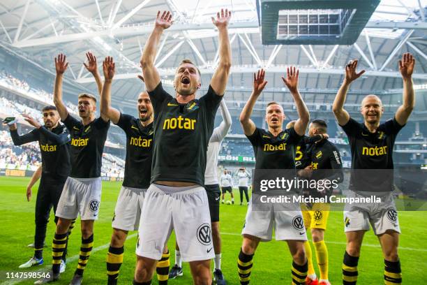 Sebastian Larsson and players from AIK celebrate their 2-0 victory in front of their supporters during an Allsvenskan match between AIK and Hammarby...