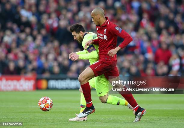 Lionel Messi of Barcelona beats Fabinho of Liverpool during the UEFA Champions League Semi Final second leg match between Liverpool and Barcelona at...