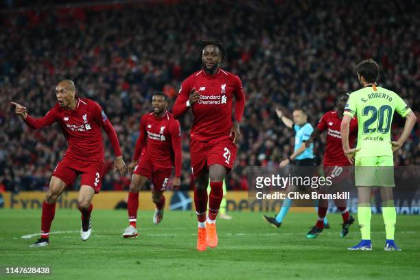 Divock Origi of Liverpool celebrates as he scores his team's fourth goal with Fabinho during the UEFA Champions League Semi Final second leg match...