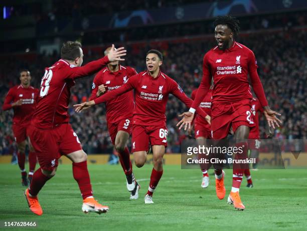 Divock Origi of Liverpool celebrates as he scores his team's fourth goal with team mates during the UEFA Champions League Semi Final second leg match...