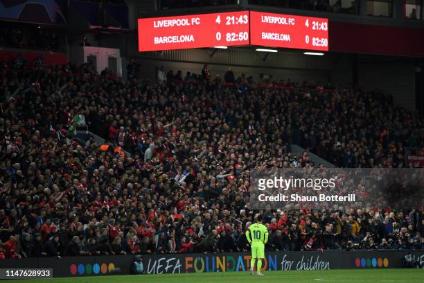 Lionel Messi of Barcelona looks dejected as the scoreboard reads '4-0' during the UEFA Champions League Semi Final second leg match between Liverpool...