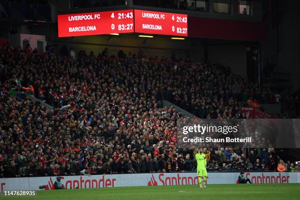 Lionel Messi of Barcelona looks dejected as the scoreboard reads '4-0' during the UEFA Champions League Semi Final second leg match between Liverpool...