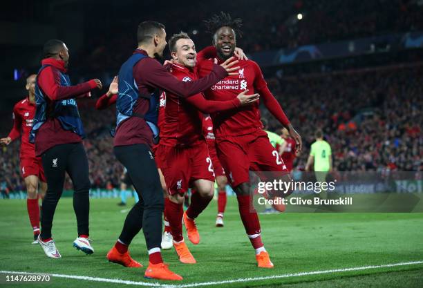 Divock Origi of Liverpool celebrates as he scores his team's fourth goal with Xherdan Shaqiri and team mates during the UEFA Champions League Semi...