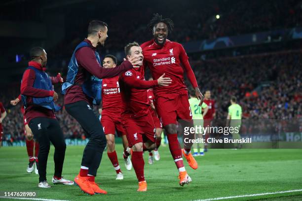 Divock Origi of Liverpool celebrates as he scores his team's fourth goal with Xherdan Shaqiri and team mates during the UEFA Champions League Semi...