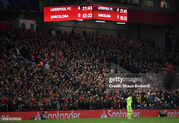 Lionel Messi of Barcelona looks dejected as the scoreboard reads '4-0' during the UEFA Champions League Semi Final second leg match between Liverpool...