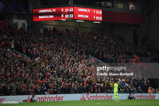 Lionel Messi of Barcelona looks dejected as the scoreboard reads '4-0' during the UEFA Champions League Semi Final second leg match between Liverpool...