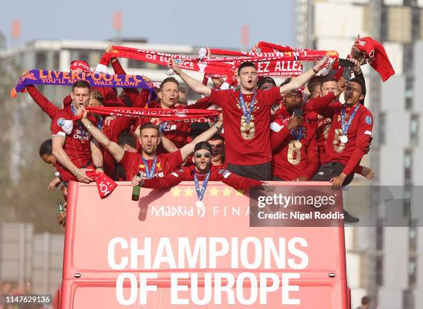 Liverpool's players celebrate on board an open-top parade bus during the UEFA Champions League victory parade, after winning yesterday's final...