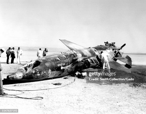An Air Force team gathers around an X-15 rocket-powered aircraft crash at Mud Lake, Nevada, November 9, 1962. Image courtesy National Aeronautics and...