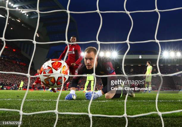 Marc-Andre Ter Stegan of Barcelona fails to stop Georginio Wijnaldum of Liverpool from scoring his team's second goal during the UEFA Champions...