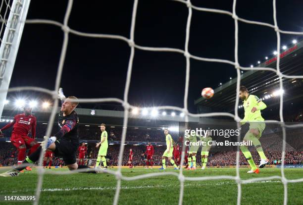 Divock Origi of Liverpool scores his team's fourth goal past Marc-Andre Ter Stegan and Gerard Pique of Barcelona during the UEFA Champions League...