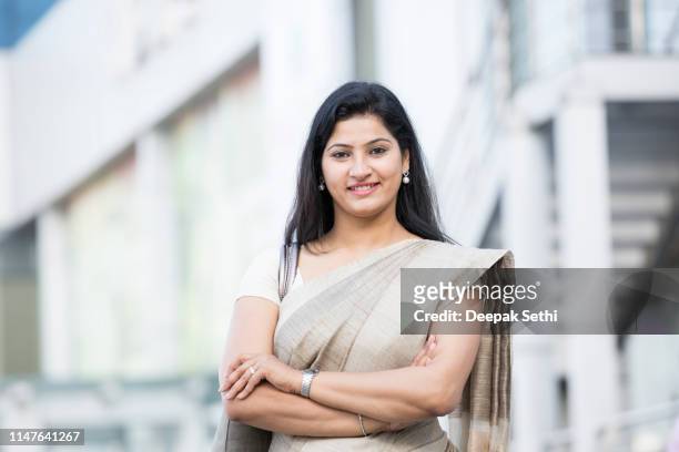 portrait of indian business woman standing  - stock images - modern india stock pictures, royalty-free photos & images