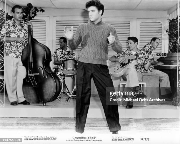 Elvis Presley with his band including guitar player Scotty Moore in a scene from the movie "Jailhouse Rock" which was released in 1957.