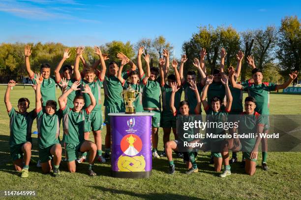 Players from Camioneros Rugby Club pose with the Webb Ellis Cup during day one of the Rugby World Cup 2019 Trophy Tour on June 2, 2019 in Buenos...
