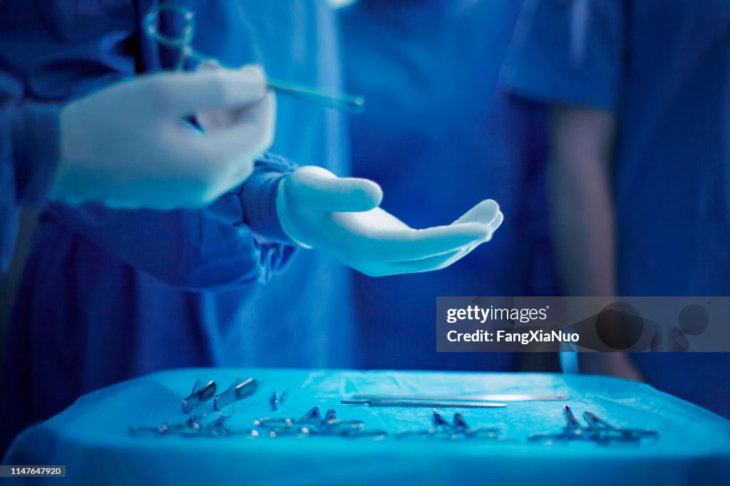 Doctor Operating Tools Handing Doctor Surgical Tool In Operating Room High-Res Stock Photo ...