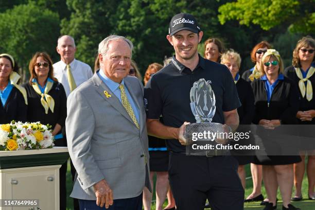 Patrick Cantlay poses with the tournament trophy and tournament hos Jack Nicklaus after winning the Memorial Tournament presented by Nationwide at...