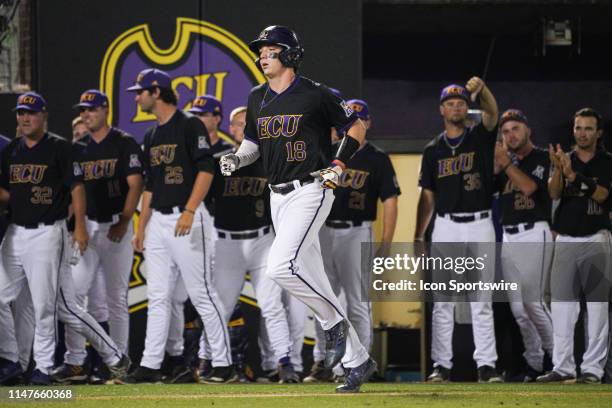 East Carolina Pirates Bryant Packard trots home after hitting a home run during a game between the Quinnipiac Bobcats and the East Carolina Pirates...