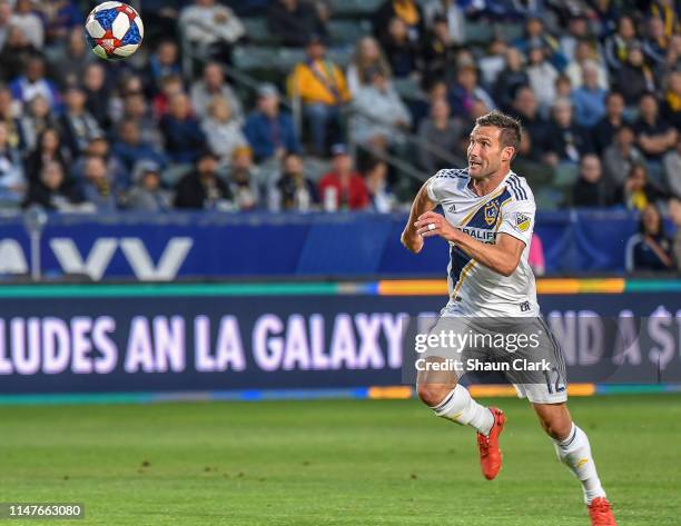 Chris Pontius of Los Angeles Galaxy races in on goal during the Los Angeles Galaxy's MLS match against New England Revolution at the Dignity Health...