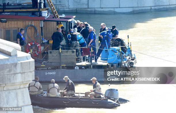Rescue efforts are under way on Danube river in Budapest on June 3, 2019 to check the position of the sunk Hungarian riverboat and continued search...