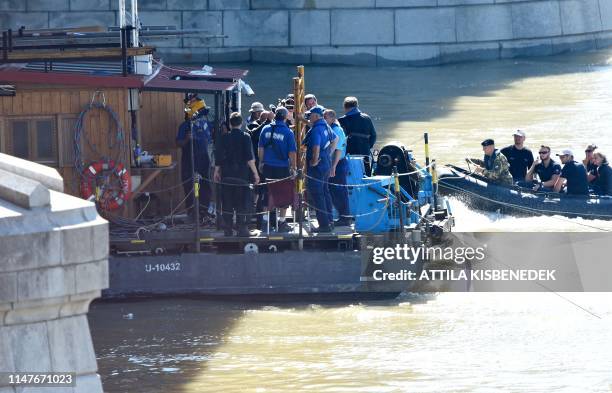 Rescue efforts are under way on Danube river in Budapest on June 3, 2019 to check the position of the sunk Hungarian riverboat and continued search...