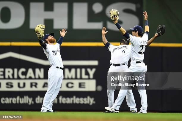 Ben Gamel, Lorenzo Cain and Christian Yelich of the Milwaukee Brewers celebrate a victory over the Washington Nationals at Miller Park on May 07,...