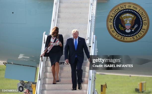 President Donald Trump and US First Lady Melania Trump disembark Air Force One at Stansted Airport, north of London on June 3 as they begin a...