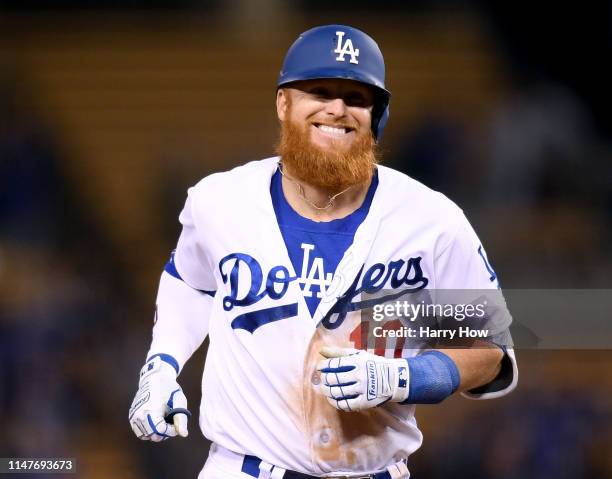 Justin Turner of the Los Angeles Dodgers reacts to his three run homerun, his third homerun of the game, for a 9-0 lead over the Atlanta Braves...