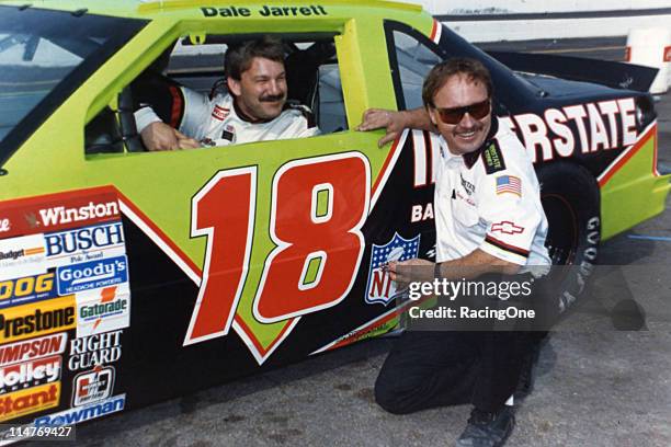 Crew chief Jimmy Makar chats with his driver Dale Jarrett at a NASCAR Cup race. It was the first year for the Joe Gibbs-owned Interstate Batteries...