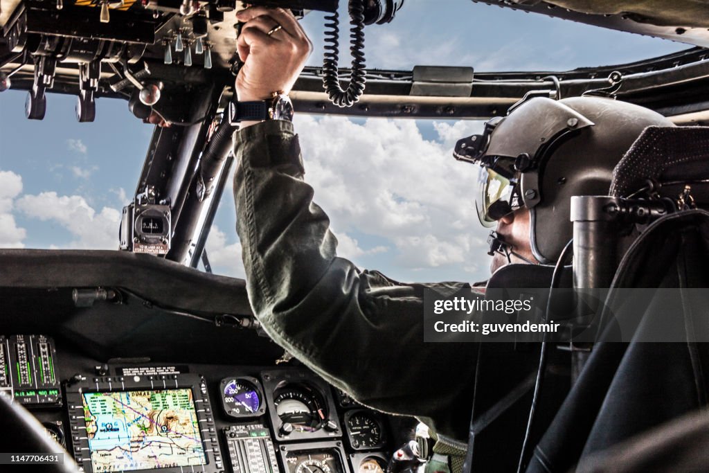 Army Helicopter Pilot riding Black  helicopter