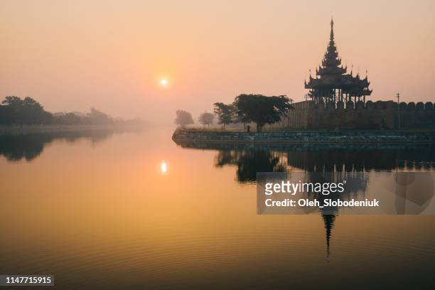 scenic view of mandalay city at sunset - mandalay stock pictures, royalty-free photos & images