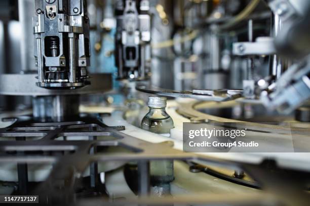 production line for juice bottling - bottling plant stock pictures, royalty-free photos & images